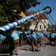 Young men wear leather trousers as they erect a traditional May pole in Kuehbach, Germany, Friday, May 1, 2026.