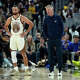 Stephen Curry of the Golden State Warriors and head coach Steve Kerr look on during a timeout against the Sacramento Kings in the second half of an NBA basketball game at Chase Center on April 7, 2026, in San Francisco.