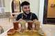 Franchisee Ahmad Badr serves a drink and treat sampler at Arwa Yemeni Coffee on April 6, 2026, in Sunnyvale, Calif.
