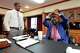Attorney Edward Blackmon Jr., 78, a civil rights attorney and a former state representative, right, demonstrates how he and other civil rights marchers were taught how to protect themselves if physically set upon by lawmen to his son State Sen. Bradford Blackmon, D-Canton, in Canton, Miss., Friday, May 1, 2026.