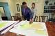 Attorney Edward Blackmon Jr., 78, a civil rights attorney and a former state representative, left, and his son, State Sen. Bradford Blackmon, D-Canton, review a 2022 redistricting map in their law office in Canton, Miss., Friday, May 1, 2026.