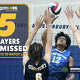 Glastonbury's Siddhanth Nitin (12) hits the ball against Simsbury's Yury Charniauski (6) and Joseph Mortimer (23) during boys volleyball action Friday, April 24, 2026, in Glastonbury.
