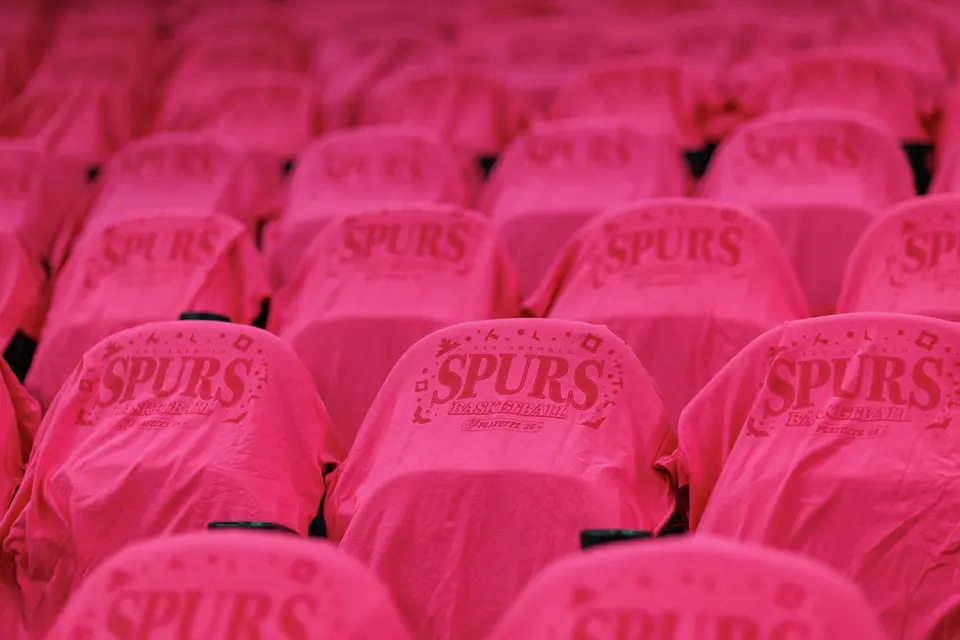 Fiesta-themed T-shirts are laid out on seats for fans before Game 1 of the Western Conference semifinals between the San Antonio Spurs and the Minnesota Timberwolves at Frost Bank Center in San Antonio on Monday, May 4, 2026.