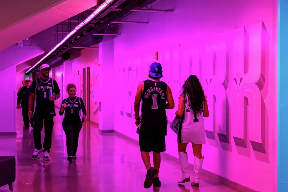 San Antonio Spurs fans walk through a colorful tunnel on the charter level of Frost Bank Center before Game 1 of the Western Conference semifinals against the Minnesota Timberwolves at Frost Bank Center in San Antonio, Monday, May 4, 2026.