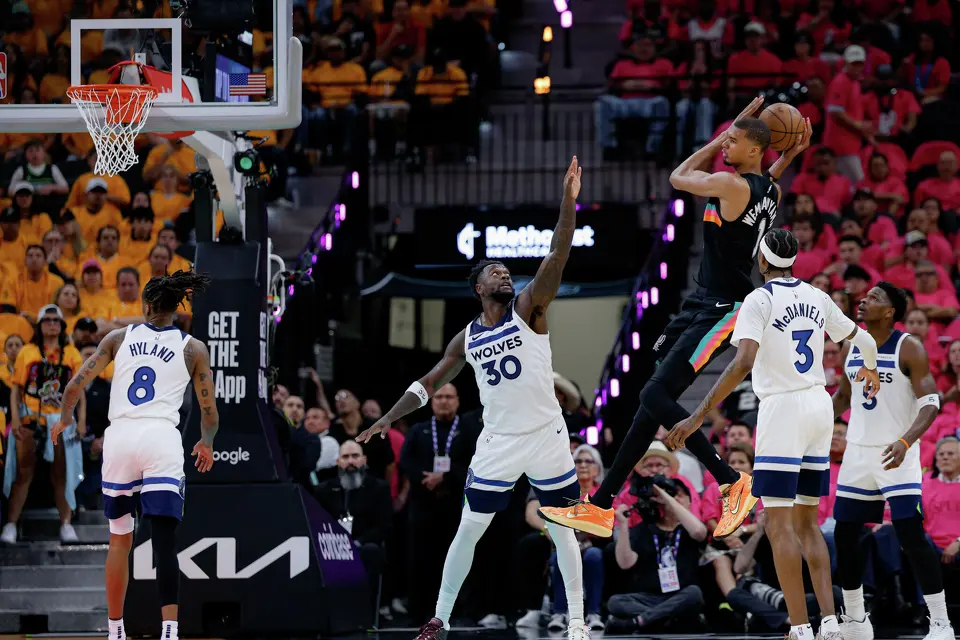 San Antonio Spurs forward Victor Wembanyama (1) makes a pass over Minnesota Timberwolves forward Julius Randle (30) during the first half of Game 1 of the Western Conference semifinals at Frost Bank Center in San Antonio, Monday, May 4, 2026.