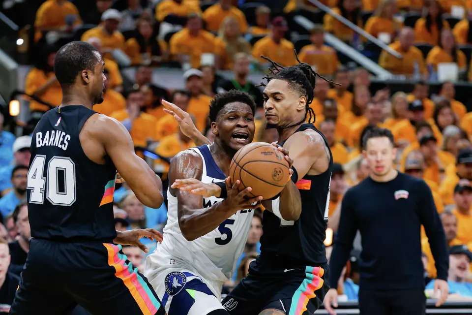 San Antonio Spurs forward Harrison Barnes (40) and guard Devin Vassell (24) guard Minnesota Timberwolves guard Anthony Edwards (5) during the first half of Game 1 of the Western Conference semifinals at Frost Bank Center in San Antonio, Monday, May 4, 2026.