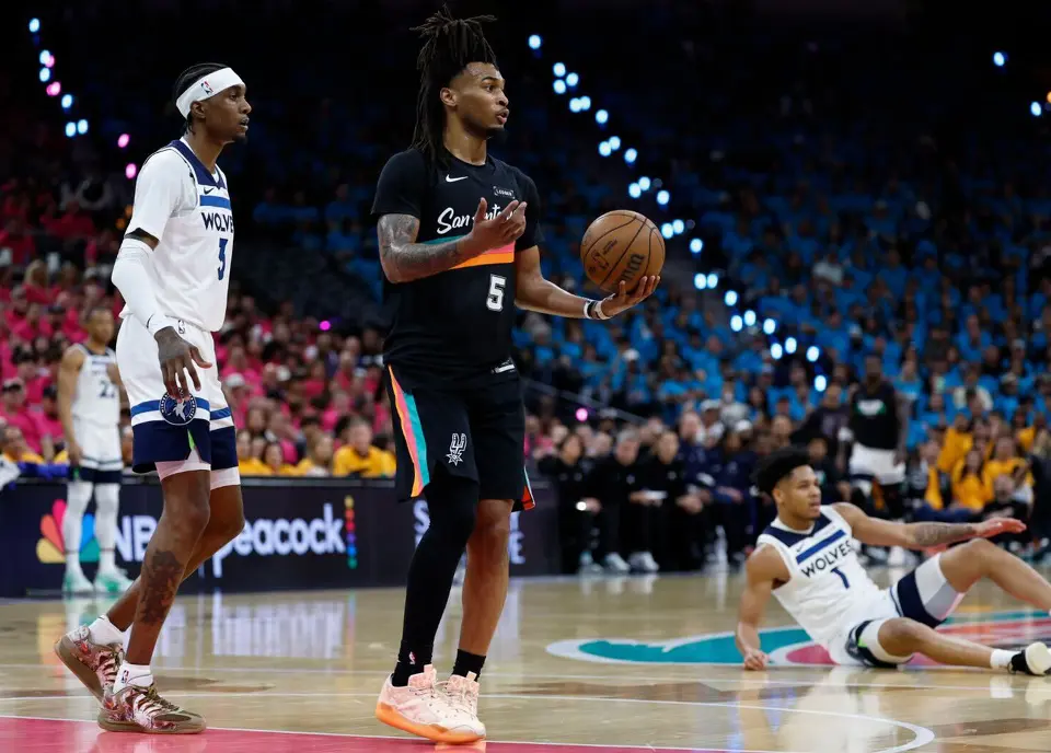 San Antonio Spurs Stephon Castle (5) reacts to drawing a foul during the third quarter against the Minnesota Timberwolves in game 1 at the Frost Bank Center.