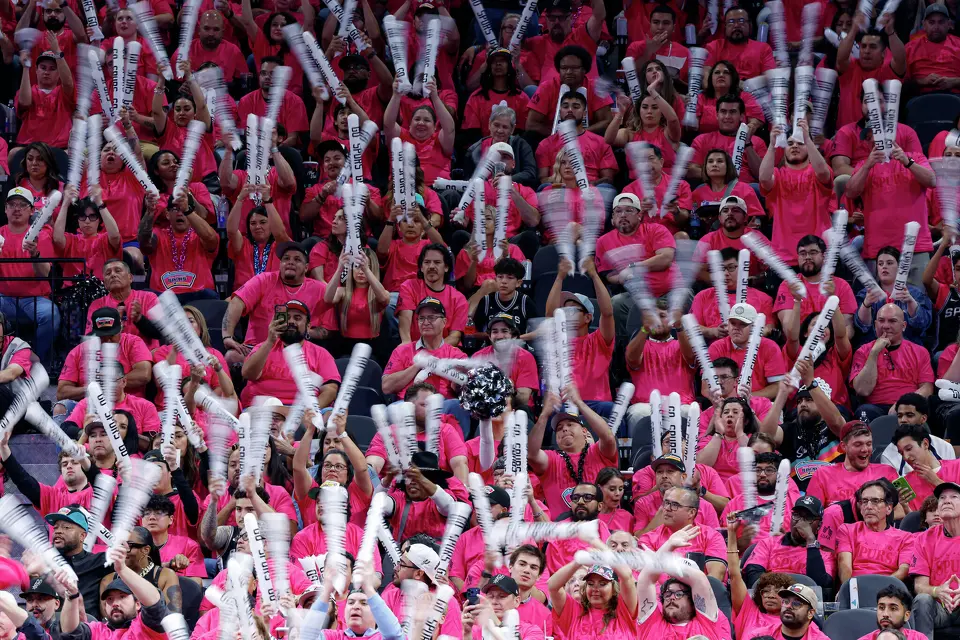 San Antonio Spurs fans wave noise makers in the air as Minnesota Timberwolves center Rudy Gobert (27) makes free throws during the second half of Game 1 of the Western Conference semifinals at Frost Bank Center in San Antonio, Monday, May 4, 2026. The Spurs fell 104-102 to the Timberwolves.