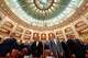 Romanian lawmakers stand during the anthem ahead of a no confidence vote against Prime Minister Ilie Bolojan's government in Romania's parliament in Bucharest, Romania, Tuesday, May 5, 2026.
