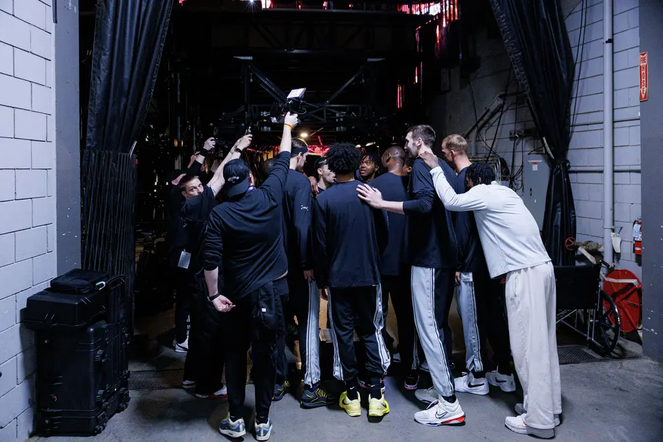 The San Antonio Spurs including two-way players Harrison Ingram, Emanuel Miller and David Jones Garcia huddle together before taking the court for Game 3 of a first-round NBA playoff series against the Portland Trail Blazers at Moda Center in Portland, Friday, April 24, 2026.