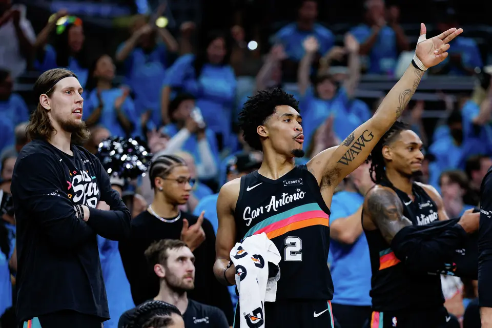 San Antonio Spurs guard Dylan Harper (2) reacts to a three-pointer made by San Antonio Spurs forward Julian Champagnie (30), not pictured, during the second half of Game 1 of the Western Conference semifinals against the Minnesota Timberwolves at Frost Bank Center in San Antonio, Monday, May 4, 2026. The Spurs fell 104-102 to the Timberwolves.