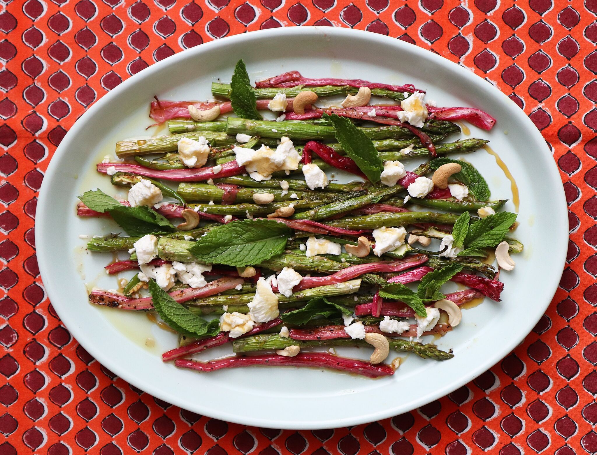 Roasted asparagus and rhubarb recipe with honey, goat cheese, cashews