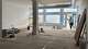 The main space of Elysian Gallery and Cafe, located at 419 E. Broadway, is filled with sunlight on May 5, 2026, as owner Jeff Bohnert enters from the front door.