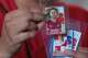 Stephany Rogel shows off her collection of soccer player cards, including João Cancelo, at her residence in Dallas on May 4, 2026.
