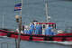 Health workers in protective gear arrive to evacuate patients from the MV Hondius cruise ship at a port in Praia, Cape Verde, Wednesday, May 6, 2026.