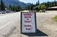 A sign warns visitors and residents to secure their bear attractants in Cooke City, Mont., one of several entrances to Yellowstone National Park, on Aug. 30, 2024.