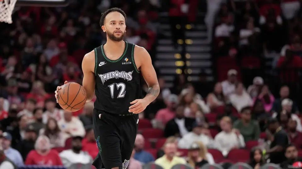 Minnesota Timberwolves forward Kyle Anderson (12) controls the ball against the Houston Rockets during the second half of an NBA basketball game, Friday, April 10, 2026, in Houston. (AP Photo/ Karen Warren)