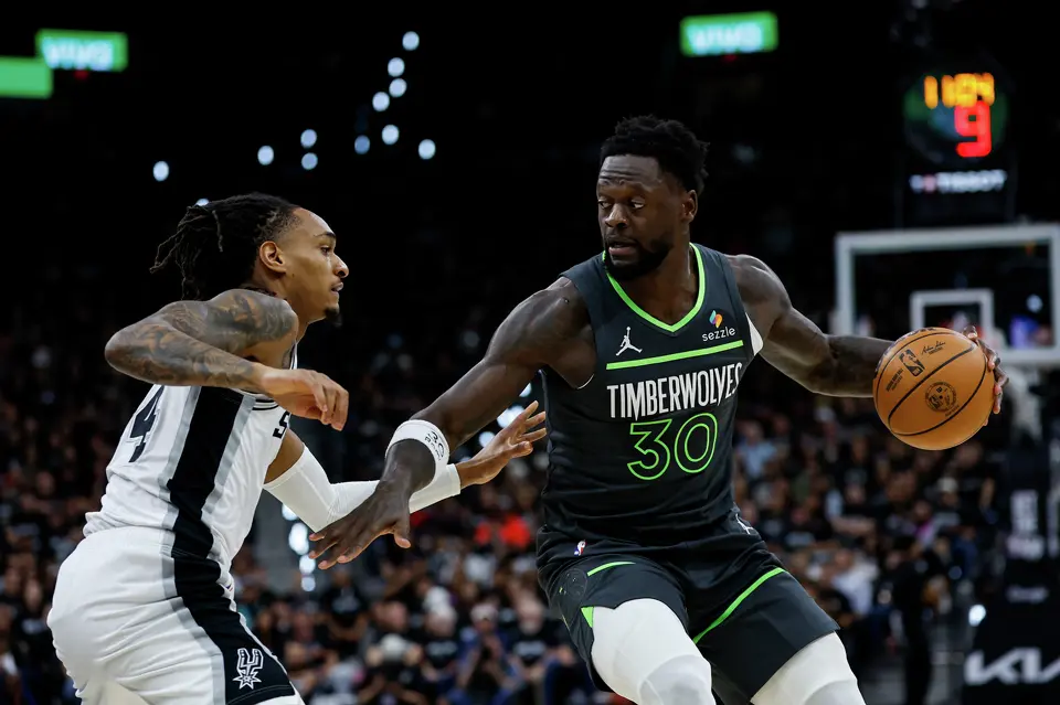 San Antonio Spurs guard De'aaron Fox (4) defends Minnesota Timberwolves forward Julius Randle (30) during the first half of Game 2 of the Western Conference semifinals at Frost Bank Center in San Antonio, Wednesday, May 6, 2026.