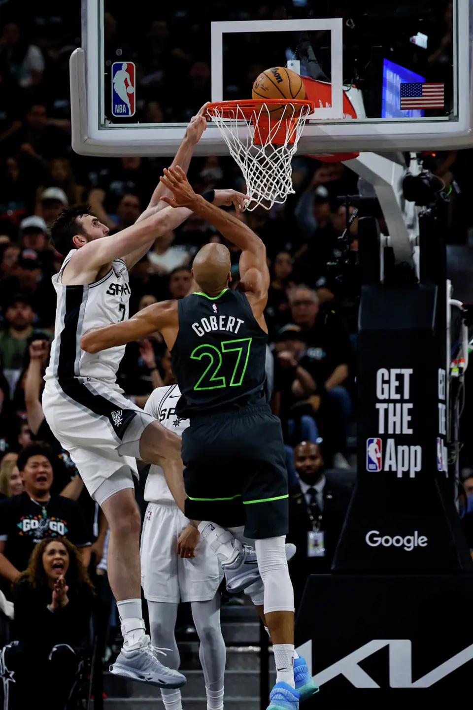 San Antonio Spurs center Luke Kornet (7) goes up to the basket while guarded by Minnesota Timberwolves center Rudy Gobert (27) during the first half of Game 2 of the Western Conference semifinals at Frost Bank Center in San Antonio, Wednesday, May 6, 2026.