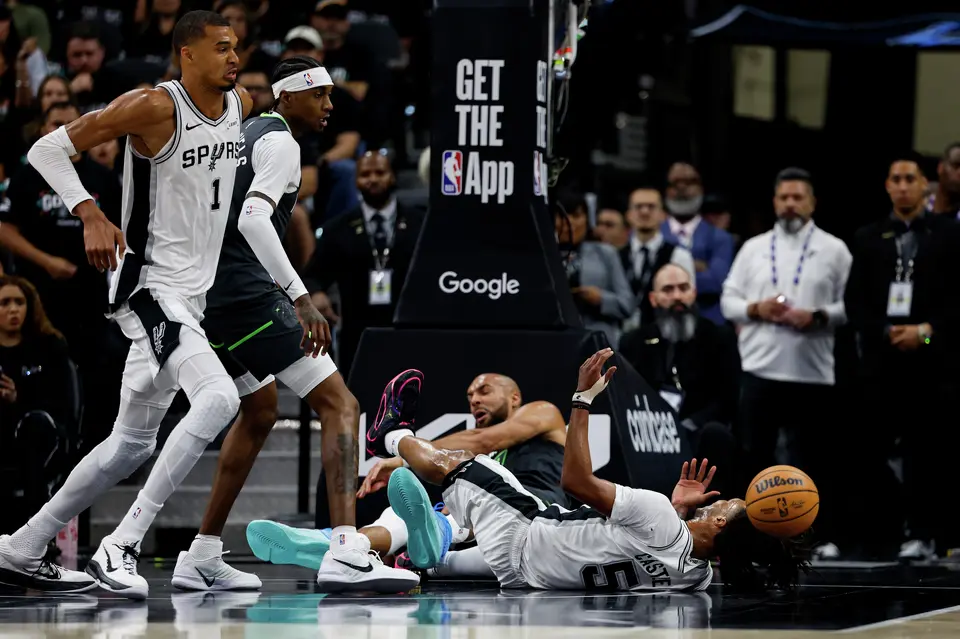 San Antonio Spurs guard Stephon Castle (5) falls on the court during the first half of Game 2 of the Western Conference semifinals at Frost Bank Center in San Antonio, Wednesday, May 6, 2026.