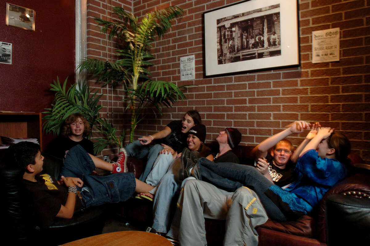 A group of teenagers clown around in a sitting area at Fuel Cyber Cafe Saturday, July 24, 2004, in Humble, Texas. 