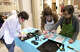 Participants work of printmaking during artist Bill Pangburn's workshop at the Art Museum of Southeast Texas, May 2.