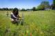 Julia Martinez works in the Field of Hope outside of St. Andrew’s Presbyterian Church in Austin, Sunday, May, 3, 2026. As the Field of Hope team lead Martinez one of her duties is to maintain the look of the crosses in the field that are intended to represent a variety of social issues the church feels need more attention. (Stephen Spillman)