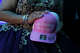 EDINBURG, TEXAS - MARCH 14: Julieta Judith Gonzalez, 14, shows the cap that Bobby Pulido gave her, which reads, "Make Quinceaneras Great Again," during her quinceanera party on March 14, 2026 in Edinburg, Texas. (Photo by Gabriel V. Cardenas - Pool/Getty Images)