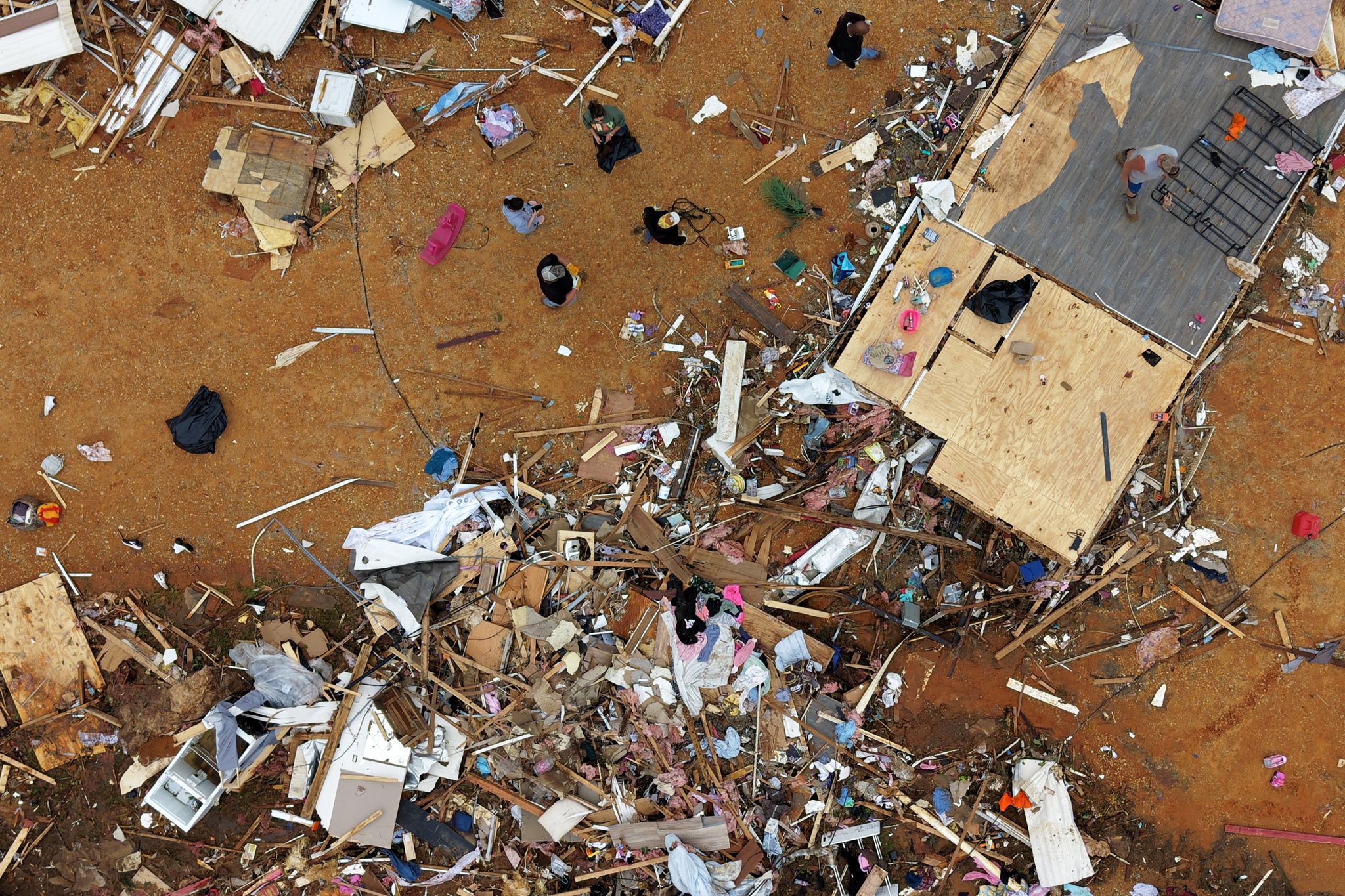 Survivors of Mississippi tornadoes crawled under furniture and held ...