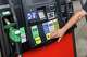 Alex Viloanueva of Garland hits the button as he pump gas at a Quicktrip station in East Dallas on Thursday, May 7, 2026.