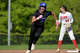 Darien’s Vivian Knott (26) heads to third for a triple in the Darien at New Canaan girls high school softball game. Thursday, May 7, 2026, New Canaan, Conn.