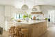 A trapezoid-shaped island offers plenty of space to prep food, dine or lounge with a beverage.