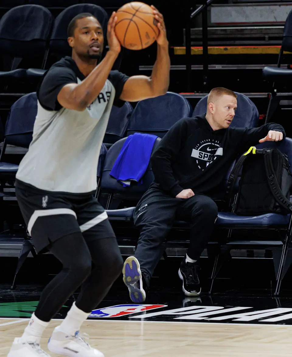 San Antonio Spurs associate coach Sean Sweeney, right, talks to a players as forward Harrison Barnes, left, participates in shootaround in preparation for Game 3 of the Western Conference semifinals against the Minnesota Timberwolves at Target Center in Minneapolis on Friday, May 8, 2026.
