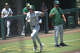 Midland College's Cole Neatherlin trots home after blasting a solo home run against Hill College, May 8, 2026, at Christensen Stadium. MC head coach Hector Rodriguez pictured in the third base coach's box. 