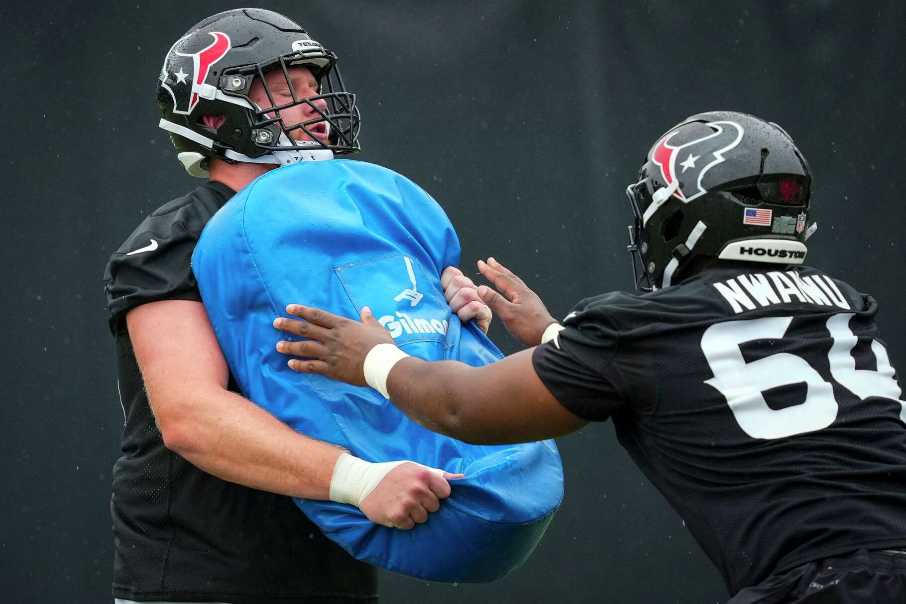 Houston Texans guard Keylan Rutledge (66) and Febechi Nwaiwu (64) run blocking drills during a rookie mini camp at Houston Methodist Training Center in Houston, Friday, May 8, 2026.
