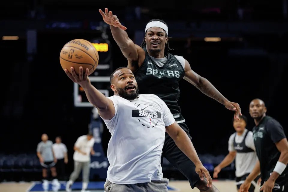 San Antonio Spurs forward Emanuel Miller, top, participates in a shootaround before Game 3 of the Western Conference semifinals against the Minnesota Timberwolves at Target Center in Minneapolis on Friday, May 8, 2026.