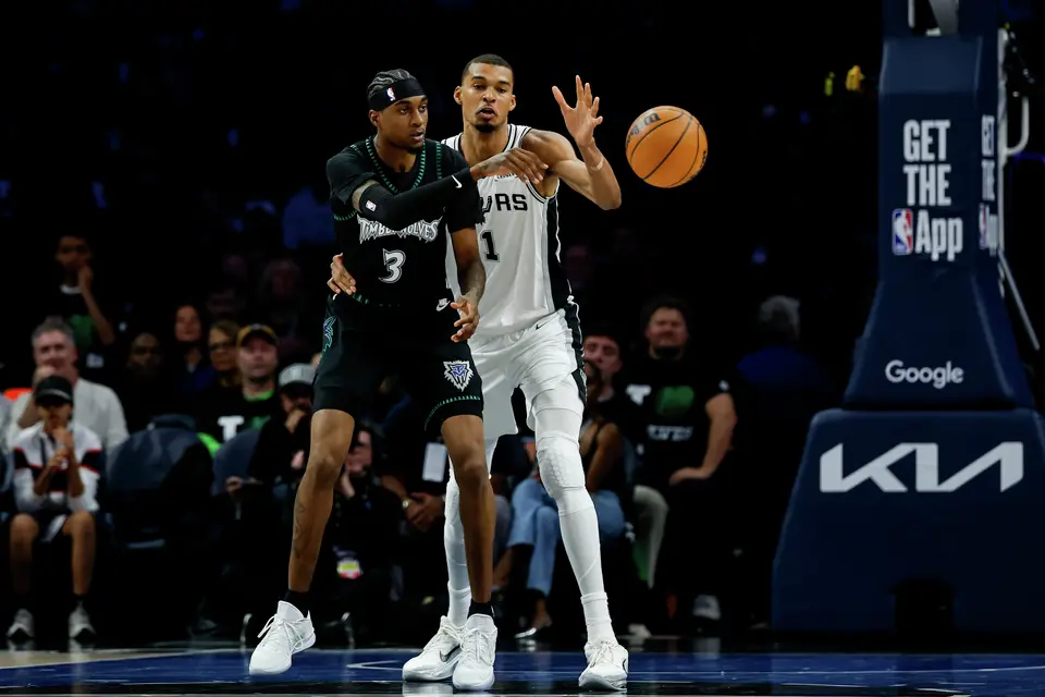 San Antonio Spurs forward Victor Wembanyama (1) guards Minnesota Timberwolves forward Jaden McDaniels (3) as he makes a pass during the first half of Game 3 of the Western Conference semifinals at Target Center in Minneapolis, Friday, May 8, 2026.