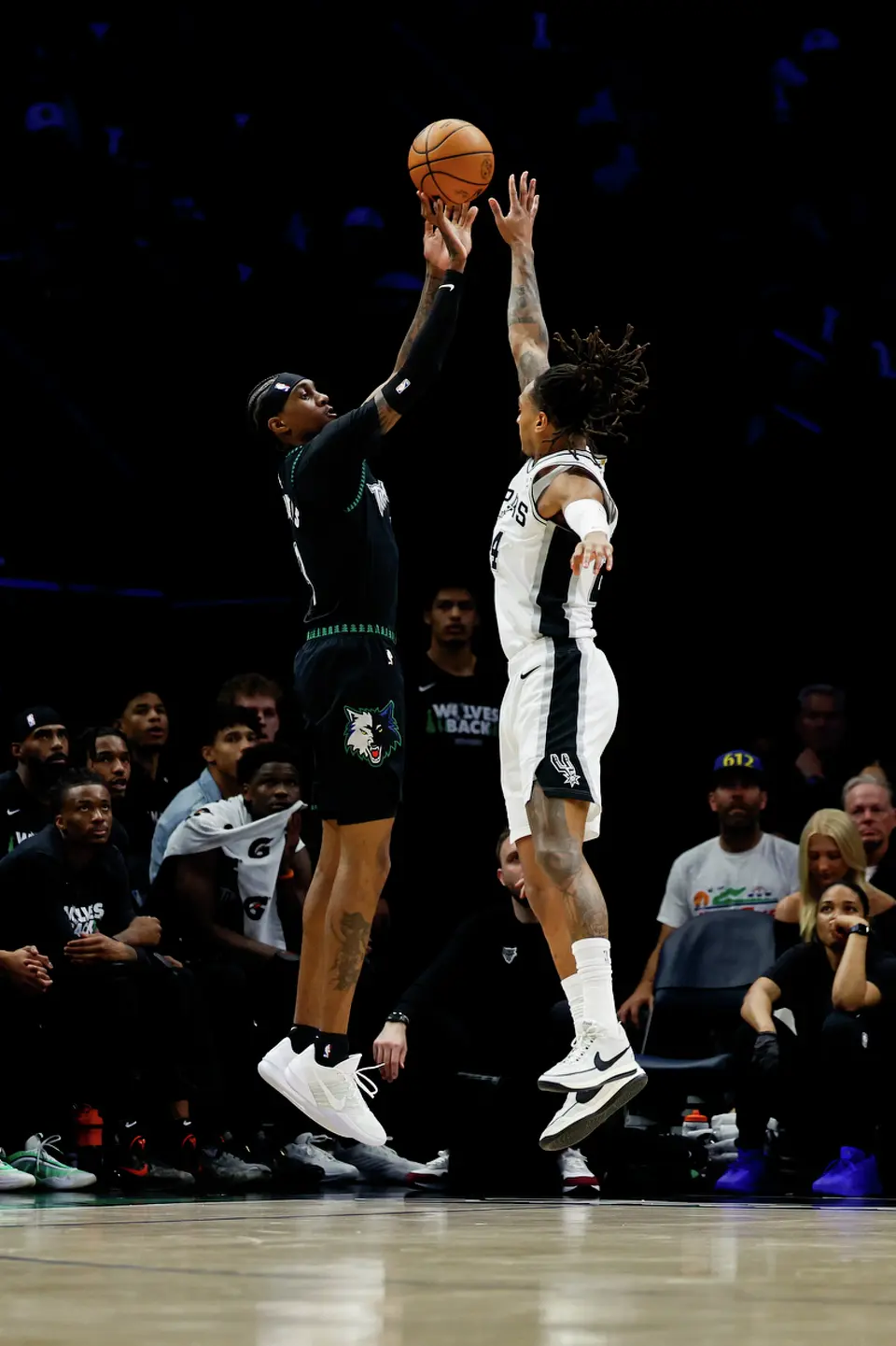 San Antonio Spurs guard Devin Vassell (24) goes up to block a shot by Minnesota Timberwolves forward Jaden McDaniels (3) during the first half of Game 3 of the Western Conference semifinals at Target Center in Minneapolis, Friday, May 8, 2026.