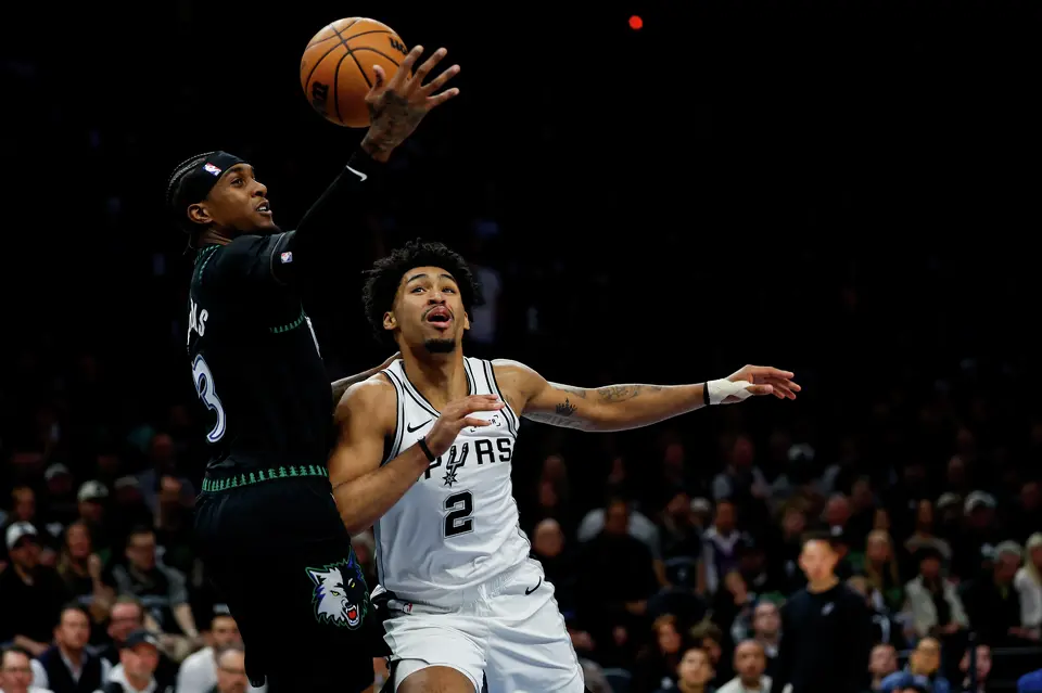 Minnesota Timberwolves forward Jaden McDaniels (3) tries to get control of the ball while guarded by San Antonio Spurs guard Dylan Harper (2) during the first half of Game 3 of the Western Conference semifinals at Target Center in Minneapolis, Friday, May 8, 2026.