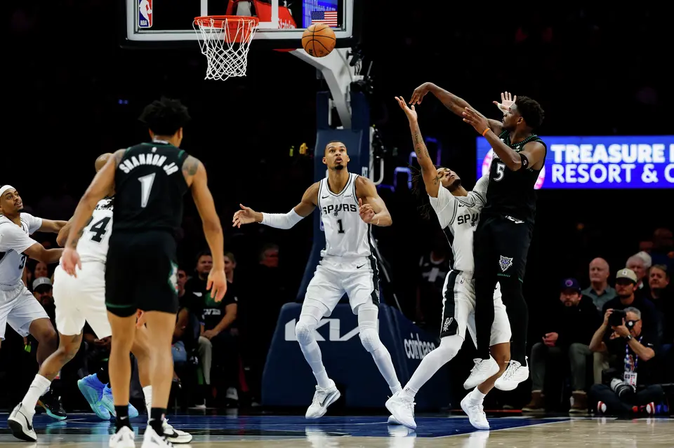 Minnesota Timberwolves guard Anthony Edwards (5) takes a shot while guarded by San Antonio Spurs guard Stephon Castle (5) during the first half of Game 3 of the Western Conference semifinals at Target Center in Minneapolis, Friday, May 8, 2026.