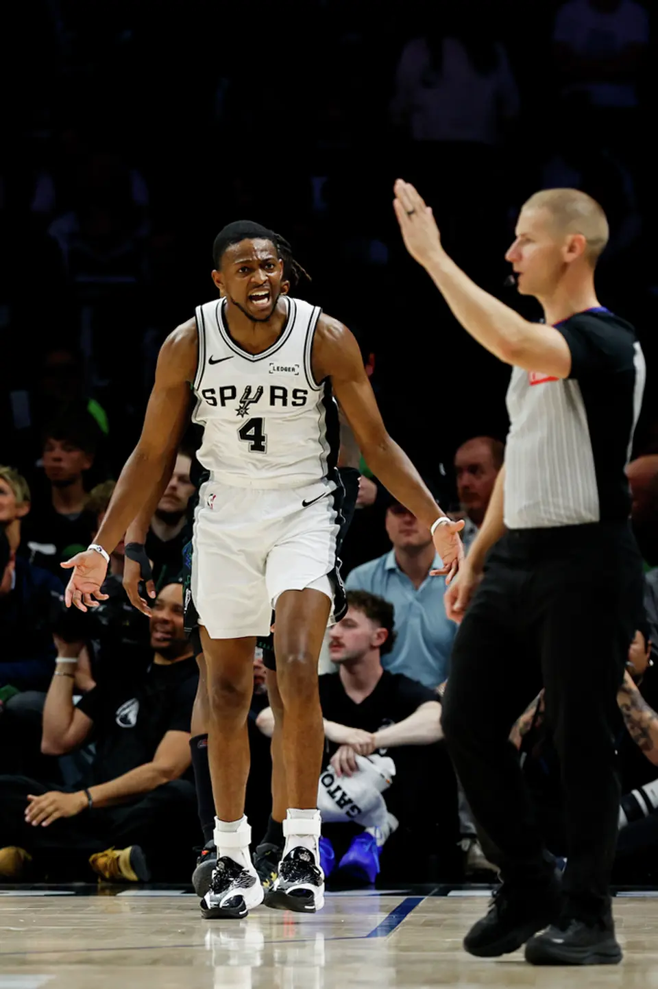 San Antonio Spurs guard De'aaron Fox (4) reacts to a call during the second half of Game 3 of the Western Conference semifinals at Target Center in Minneapolis, Friday, May 8, 2026. The Spurs defeated the Timberwolves 115-108, leading the series 2-1.