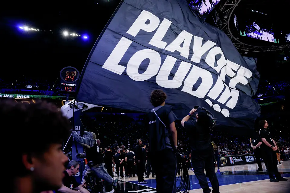 Fans wave a flag during the second half of Game 3 of the Western Conference semifinals at Target Center in Minneapolis, Friday, May 8, 2026. The Spurs defeated the Timberwolves 115-108, leading the series 2-1.