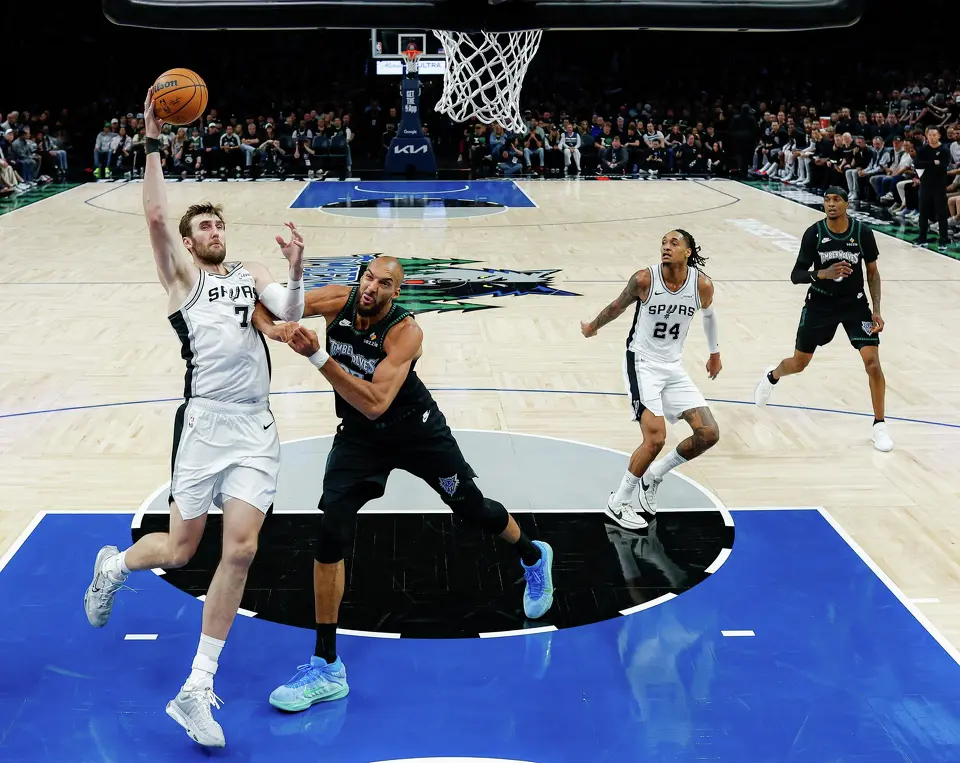 San Antonio Spurs center Luke Kornet (7) goes up for a shot as Minnesota Timberwolves center Rudy Gobert (27) guards him during the second half of Game 3 of the Western Conference semifinals at Target Center in Minneapolis, Friday, May 8, 2026. The Spurs defeated the Timberwolves 115-108, leading the series 2-1.
