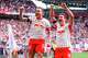 Leipzig's Willi Orban, right, celebrates with and David Raum after scoring, during the German Bundesliga soccer match between RB Leipzig and FC St. Pauli, in Leipzig, Germany, Saturday, May 9, 2026. (Jan Woitas/dpa via AP)