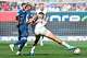 Hoffenheim's Albian Hajdari, left, and Bremen's Salim Musah fight for the ball, during the German Bundesliga soccer match between TSG 1989 Hoffenheim and Werder Bremen, in Sinsheim, Germany, Saturday, May 9, 2026. (Uwe Anspach/dpa via AP)