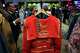 Guests browse through one-of-a-kind jackets designed by artists for auction during the House of DIFFA gala in Dallas, Saturday, May 9, 2026.
