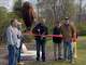 Big Rapids celebrated Migratory Bird Day and its Bird City designation with an event at Northend Riverside Park on May 9. Artist John Warner cuts the ribbon on the newly installed Bird Sculpture during the celebration with, from left: orinthologist Joe Lipar, Artworks Executive Director Arthur Johnson, Warner, Mayor Fred Guenther and City Manager Mark Gifford.