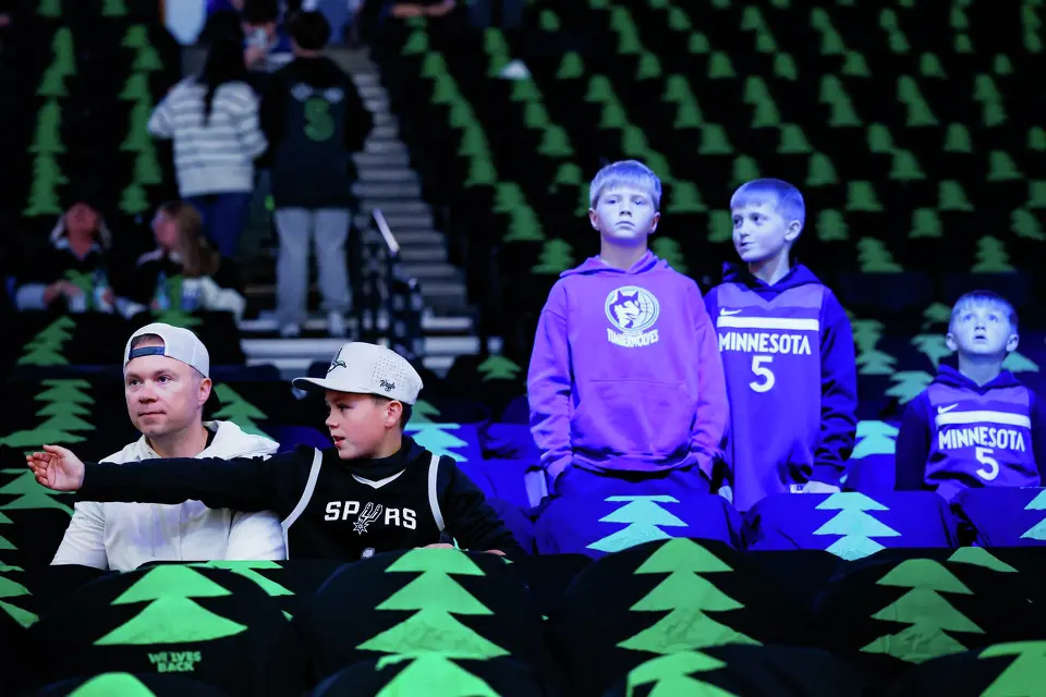 San Antonio Spurs fans watch the team warm up alongside Minnesota Timberwolves fans before Game 4 of the Western Conference semifinals at Target Center in Minneapolis on Sunday, May 10, 2026.