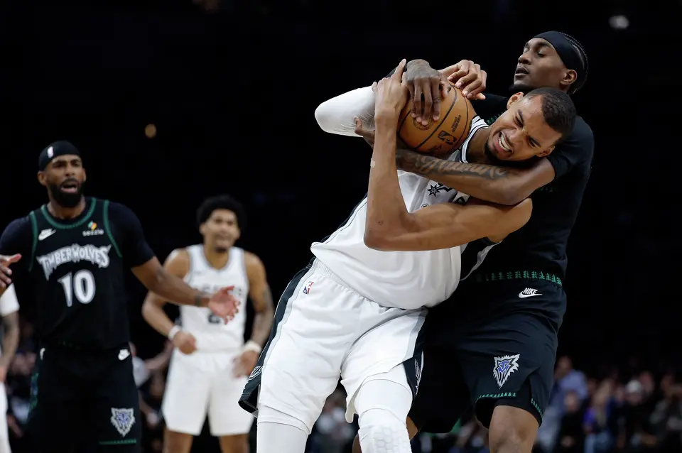 San Antonio Spurs forward Victor Wembanyama (1) fights for a rebound with Minnesota Timberwolves forward Jaden McDaniels (3) before drawing a flagrant fowl charge by throwing an elbow to the face of Minnesota Timberwolves center Naz Reid (11), not pictured, leading to Wembanyama’s ejection in the 2nd quarter of Game 4.