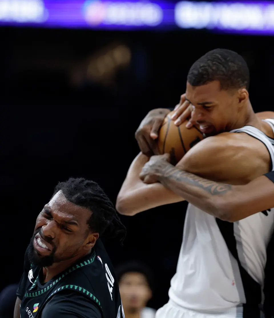 San Antonio Spurs forward Victor Wembanyama (1) fights for a rebound before drawing a flagrant fowl charge after throwing an elbow to the face of Minnesota Timberwolves center Naz Reid (11) leading to his ejection in the 2nd quarter of Game 4.